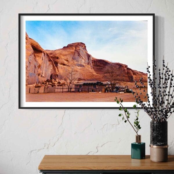 Framed Desert Landscape Photo over Console with Green Vase and Dry Branches in Modern Decor