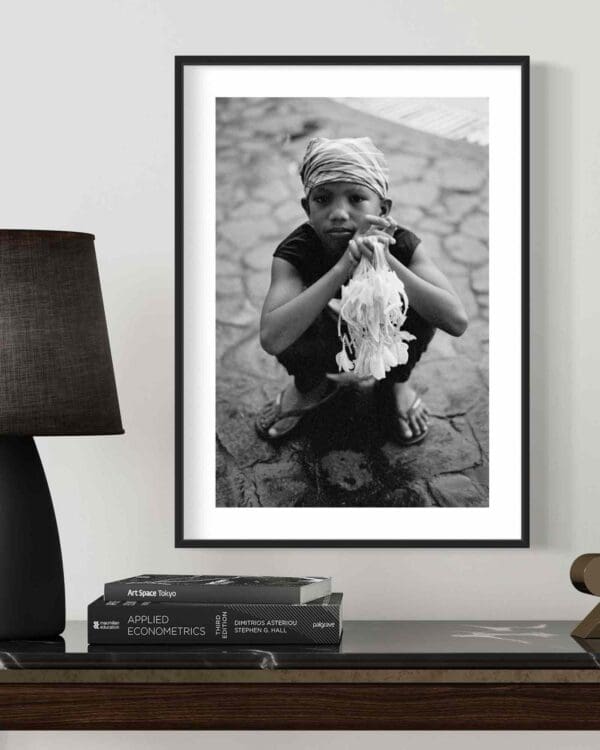 Framed Black and White Photo of Child in Cultural Outdoor Setting