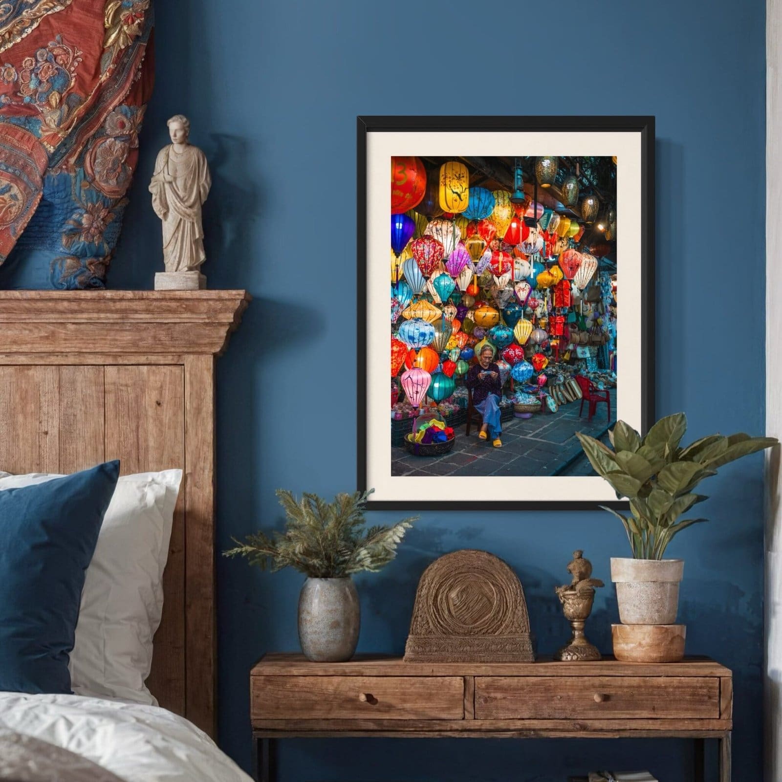 Cozy interior with vibrant market photo and eclectic decor on blue wall.