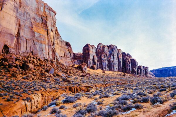 Daytime desert landscape with dramatic rock formations in Monument Valley.