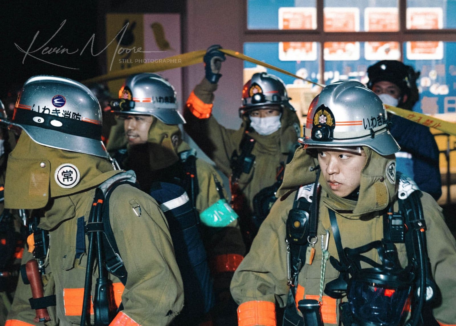 Japanese firefighters in action during a nighttime emergency