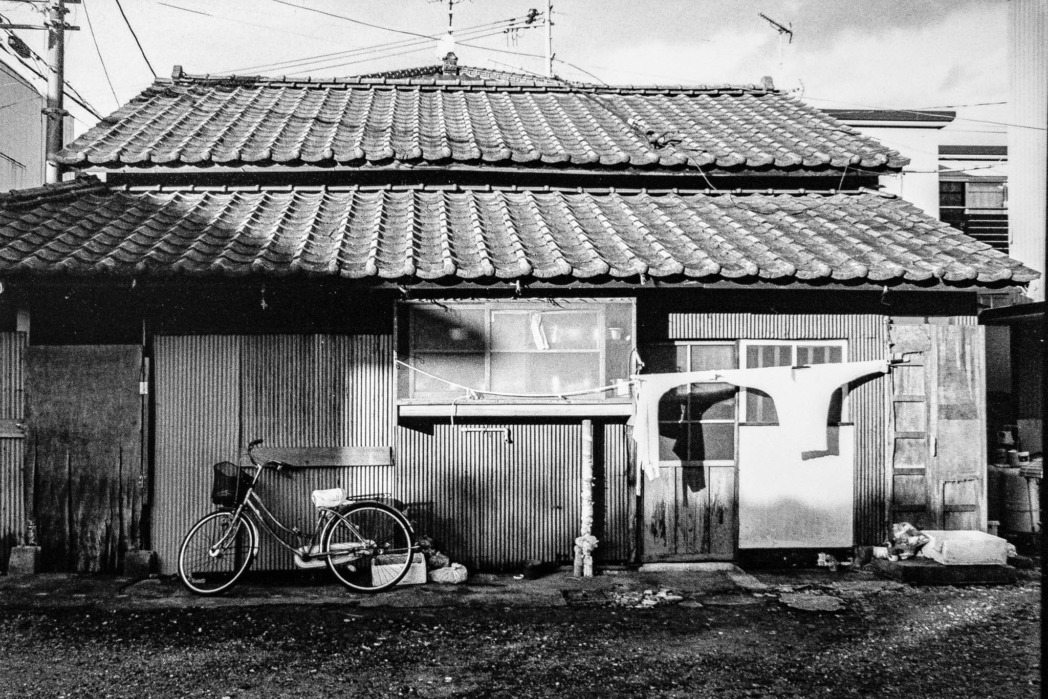 Old rustic Japanese house with bicycle