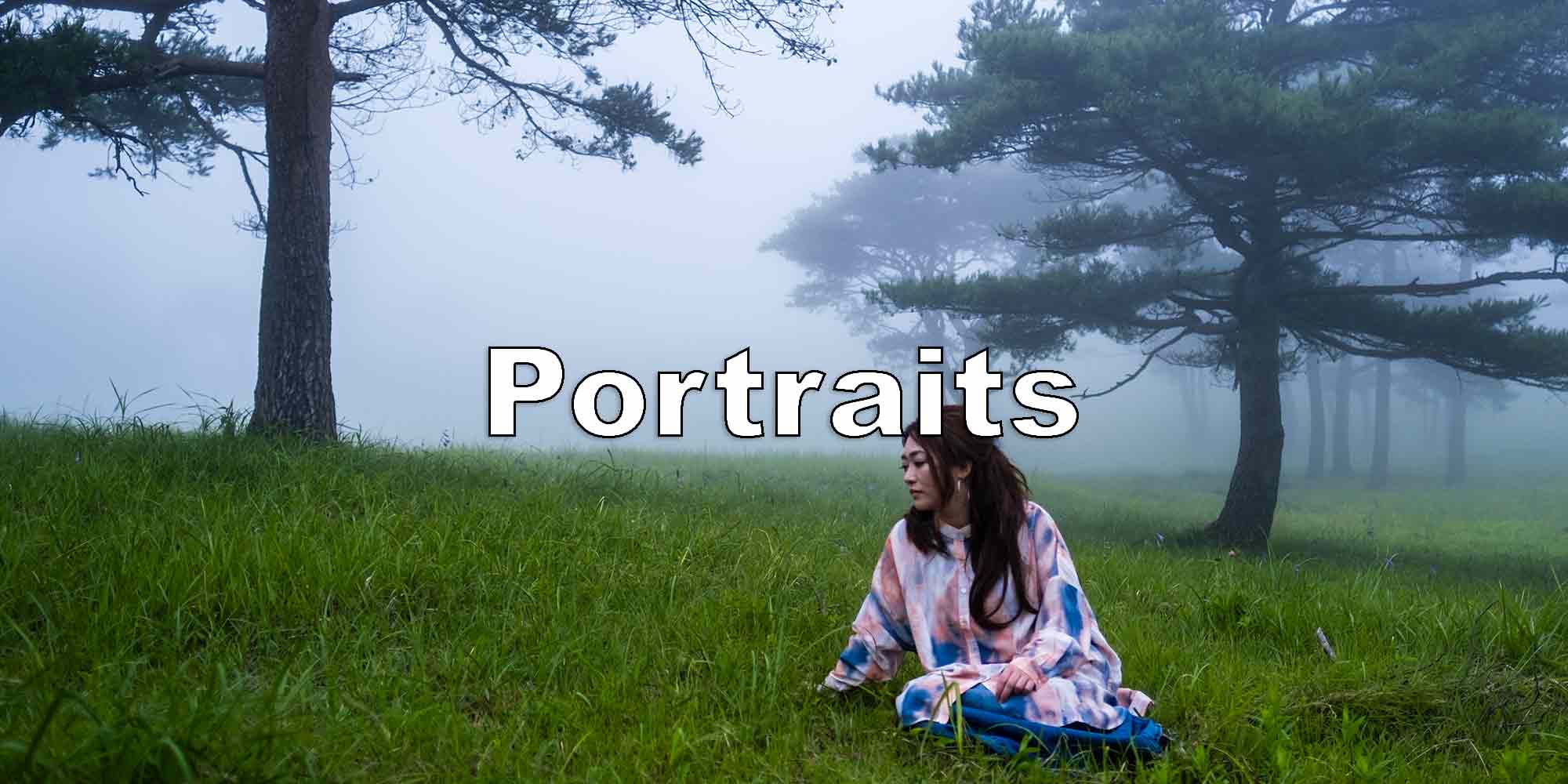Misty portrait of woman wrapped in blanket amidst foggy forest, part of photography portfolio.