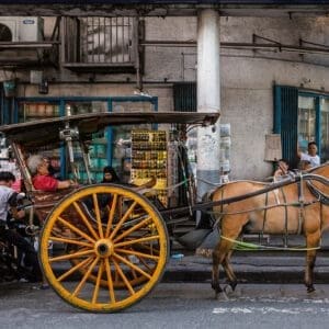 Philippines art print from Angeles City: a kalesa horse carriage and its sleeping driver at rest on the street